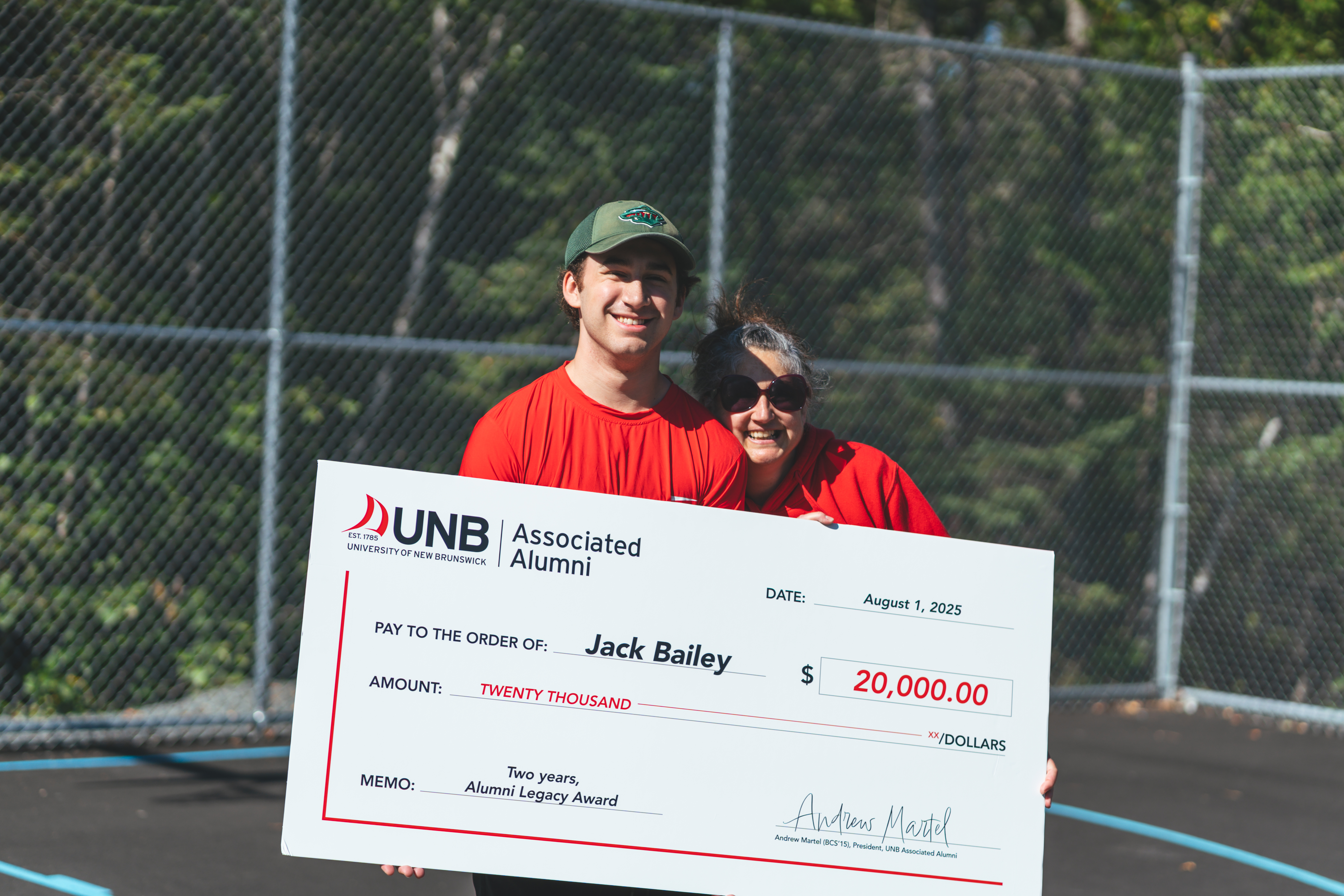 Alumni Legacy Award recipient, Jack Bailey, with novelty cheque