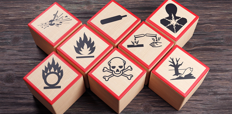 Photograph of wooden blocks with different warning labels on them